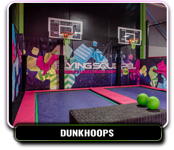 Basketball hoops over a trampoline court.
