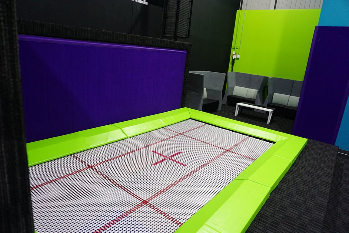 Performance trampoline with a sitting area.
