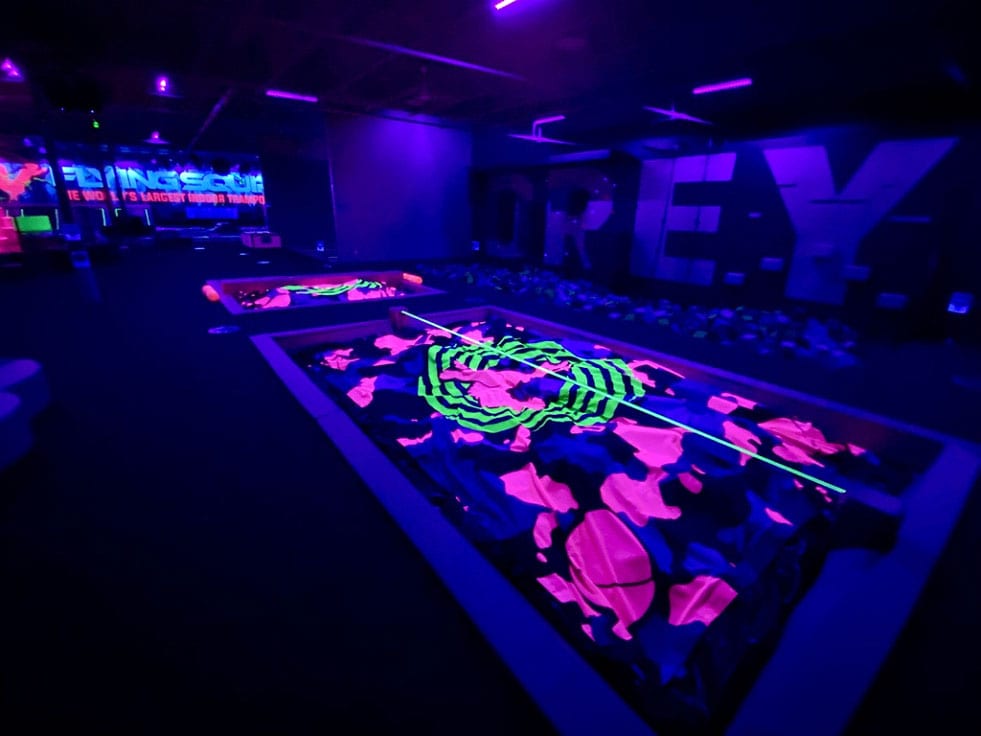 UV Reactive Foam Pit Covers with slackline and battle beam.