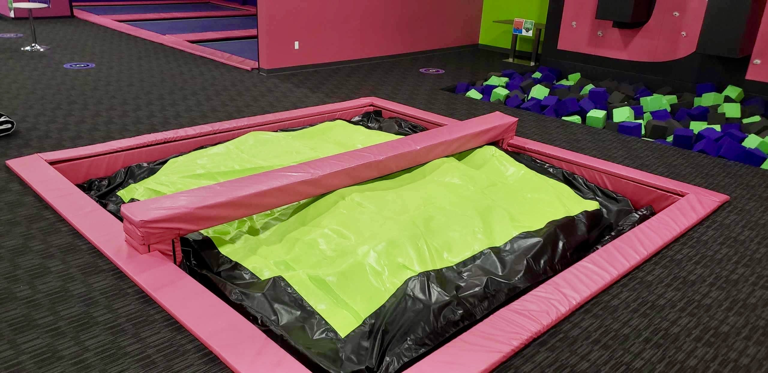 Battle beam over foam pit cover.