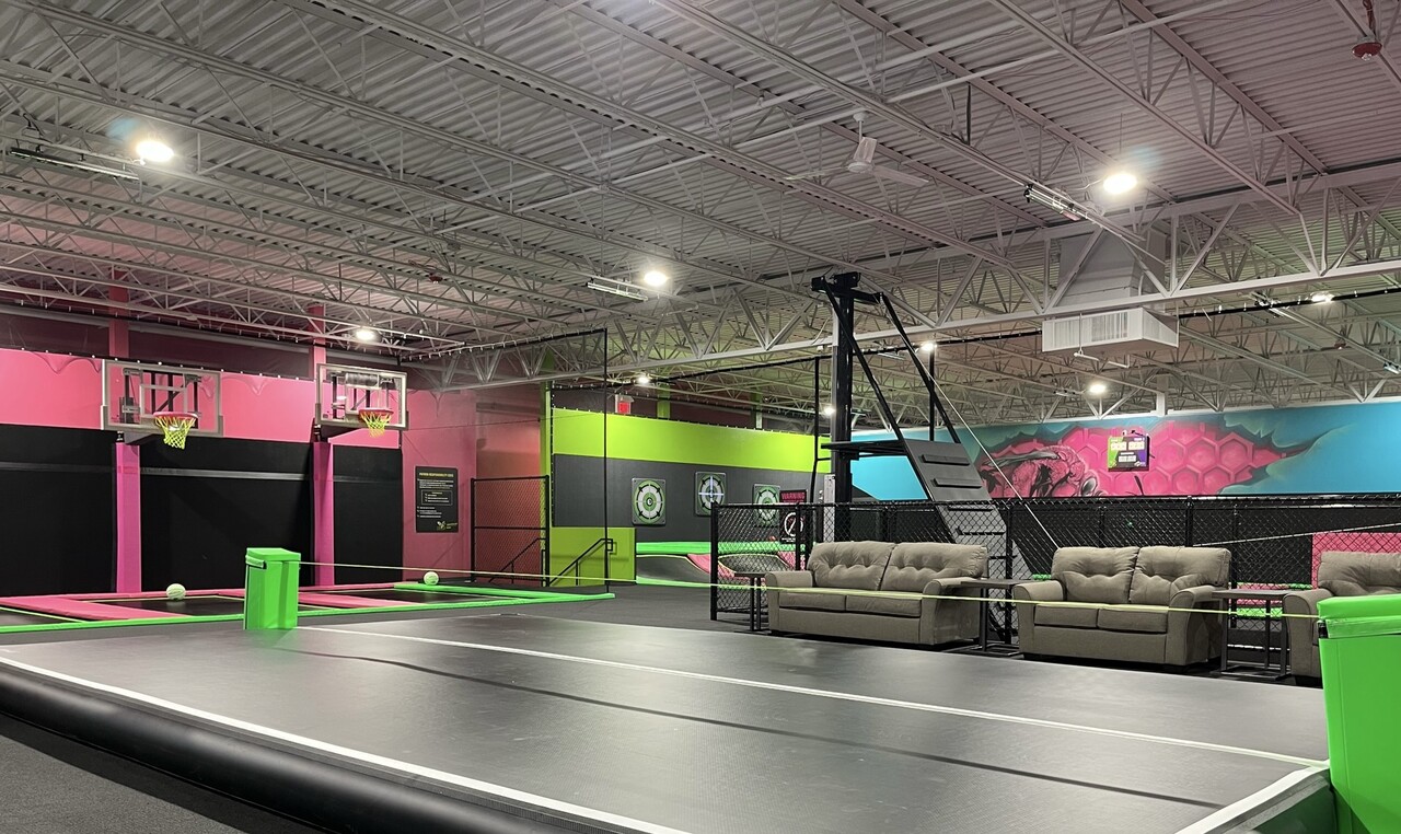 Sport court attraction in a trampoline park