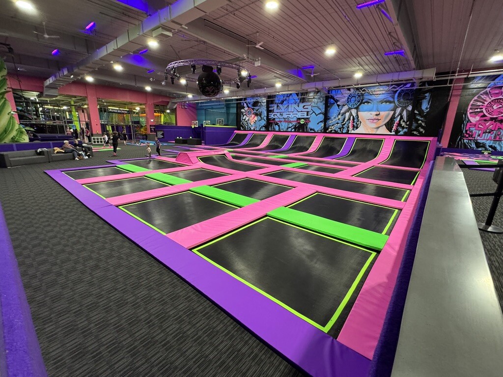 Freestyle trampoline court — guests jumping across the main court