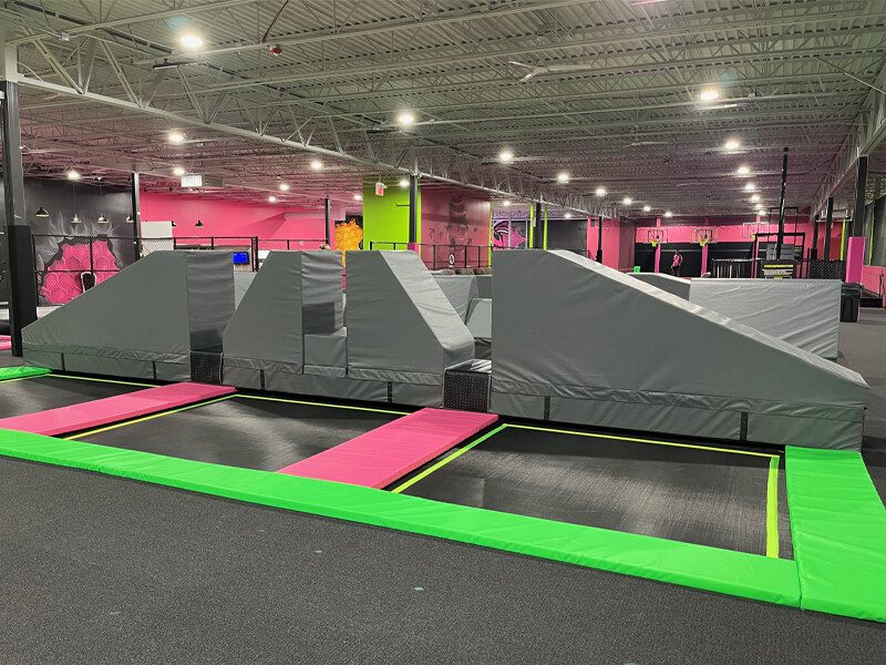 Obstacle course base plate attachment system