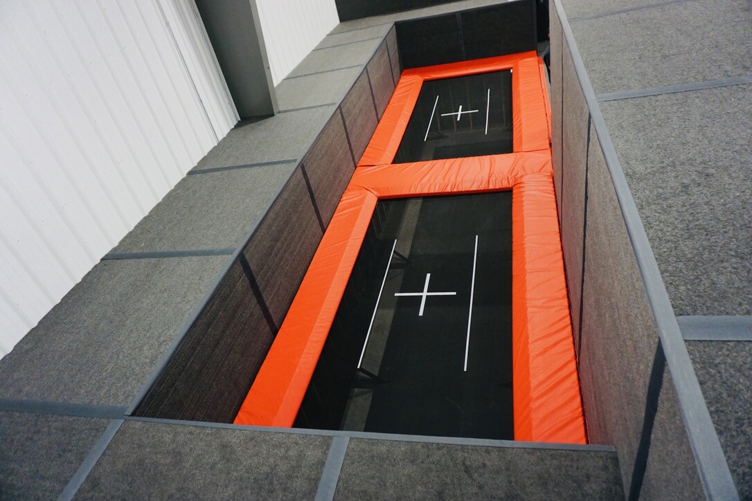 Performance trampoline court