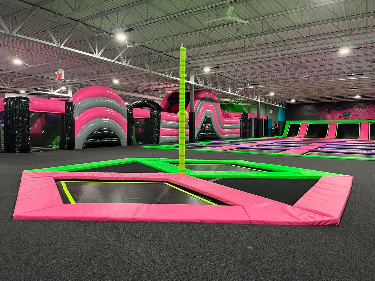 Shock trampoline tetherball court