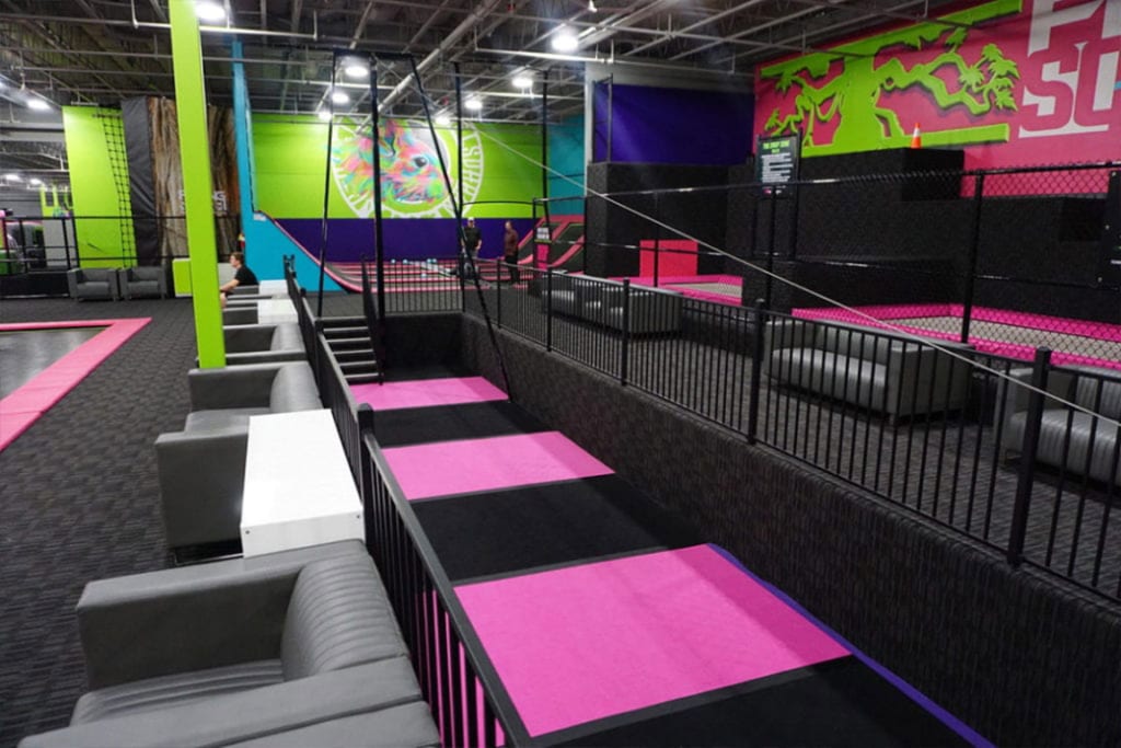 Guest riding an indoor zipline