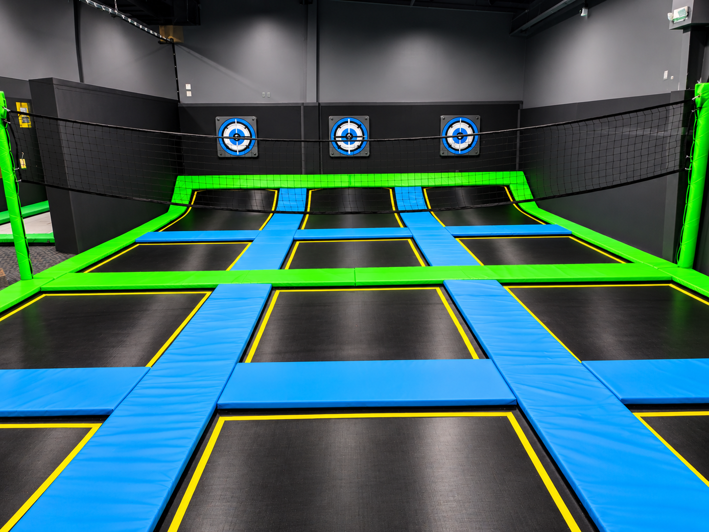 Extreme trampoline dodgeball court with a volleyball net