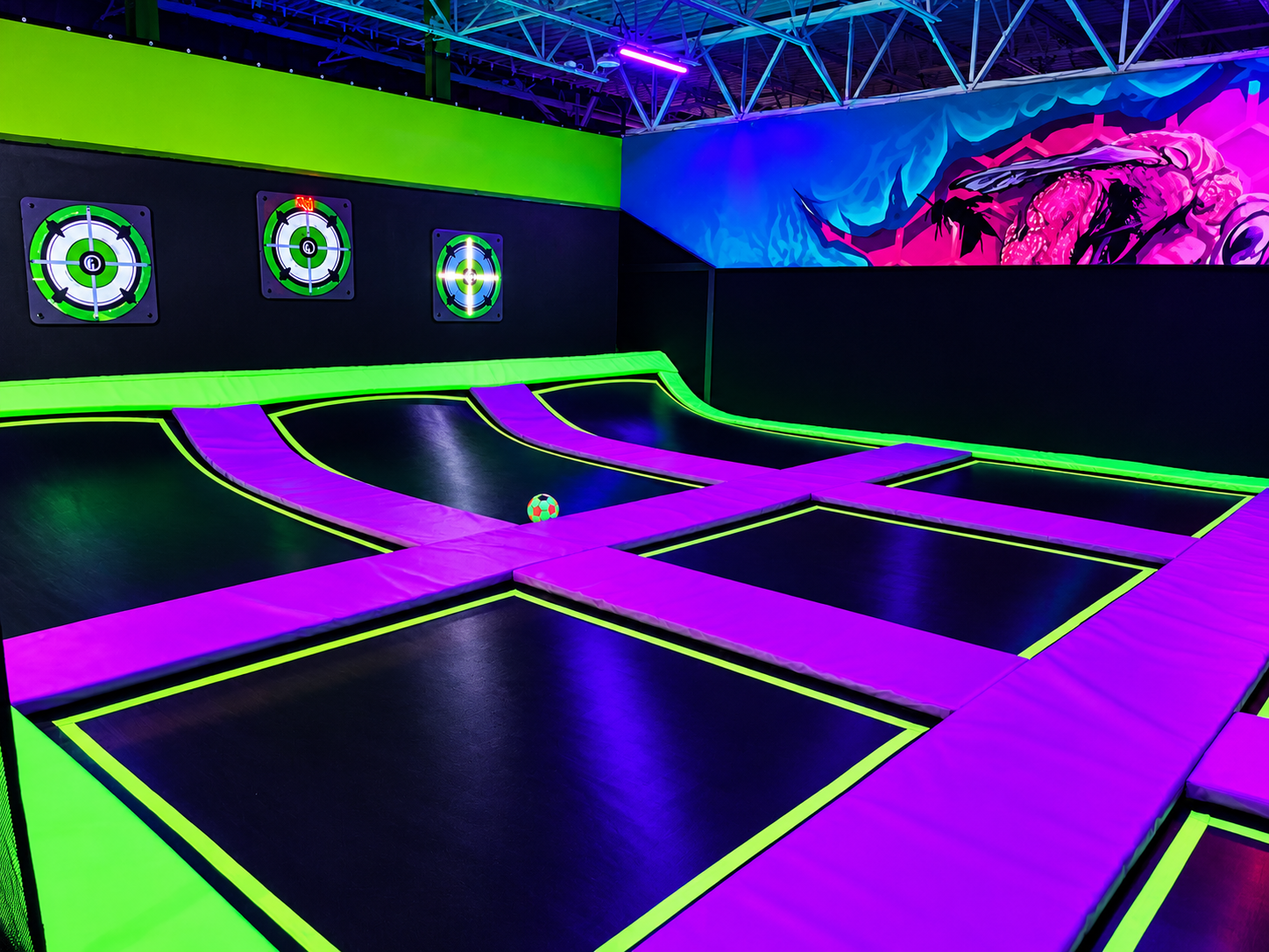 Trampoline dodgeball court with neon glow pads